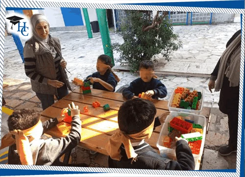 Children working with colorful construction materials at classroom tables