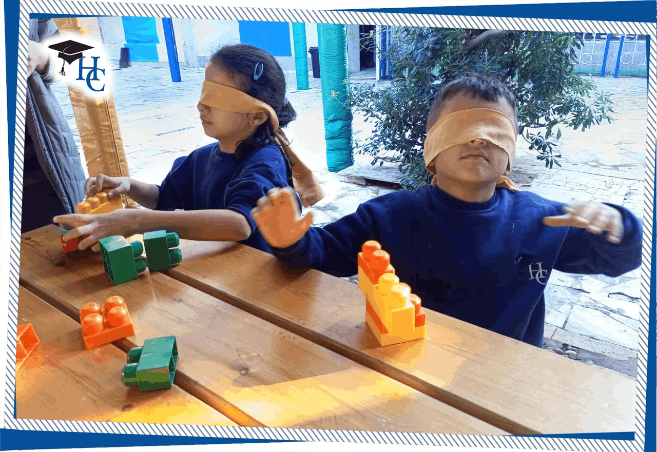 Young children building with colorful blocks in a classroom