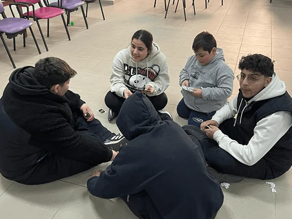 Students sitting together during a community service visit